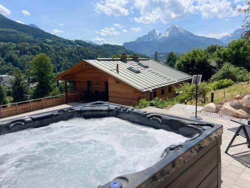 a large plunge pool in front of a house at Chalet Wachterfeld in Berchtesgaden