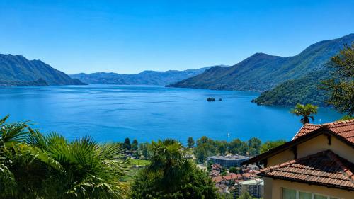 a view of a lake with mountains in the background at Borgo Paradiso Guest House in Maccagno Inferiore
