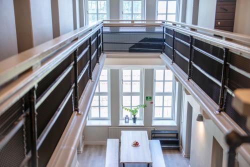 a staircase in a building with a table at STF Visby Hamn Vandrarhem in Visby