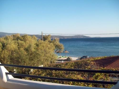 a view of the ocean from a balcony at Oasis studios in Psili Ammos