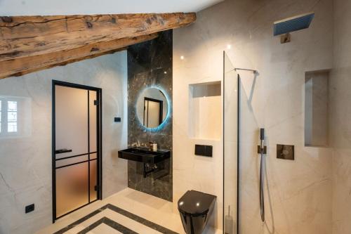 a bathroom with a shower and a sink at Villa Ofellia in Dubrovnik