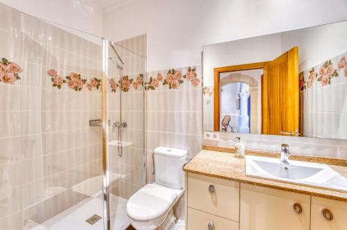 a bathroom with a shower and a toilet and a sink at Ideal Property Mallorca - Can Peret in Sa Pobla