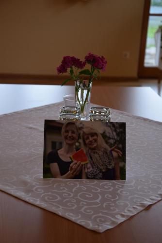 a picture of two women on a white table at Bauernhof Flucher-Plaschg in Straden