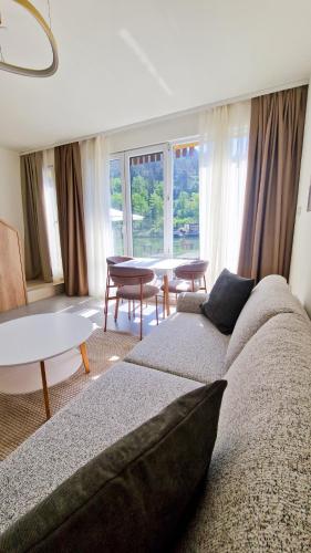a living room with a couch and a table at Waterside Houses in Ognyanovo