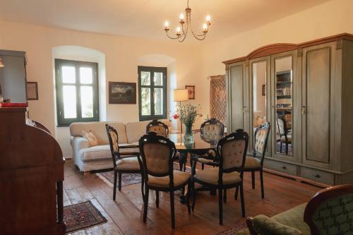 a living room with a table and chairs at Villa Rustica Vendégház Sümeg in Sümeg