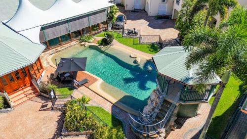 an overhead view of a swimming pool in a house at Tinaroo Lodge Lakeview Escape with Pool Access in Tinaroo