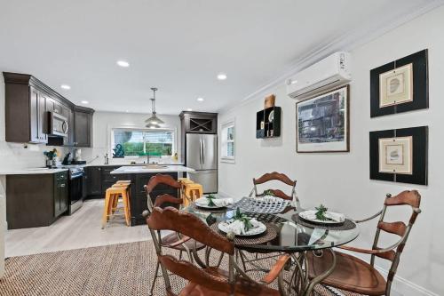 a kitchen and dining room with a table and chairs at Battery Place in Savannah