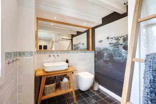 a bathroom with a sink and a toilet at Gästehaus Altes Forstamt Sinntal in Sinntal