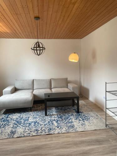 a living room with a couch and a coffee table at Apartment Kuhl in Selb