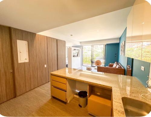 a kitchen with a counter and a sink in a room at Distrito Prime 1-302 in Bogotá