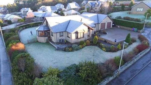 an aerial view of a house with a yard at One Strathview B&B in Forfar