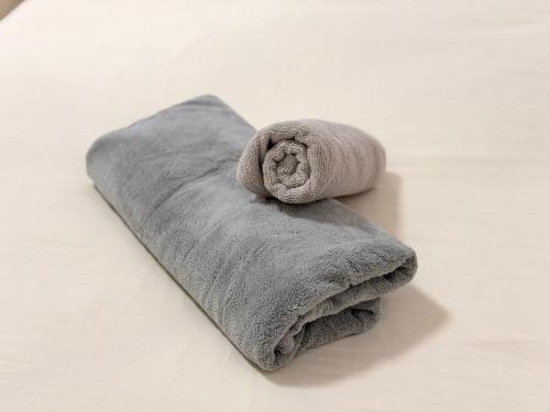 a towel sitting on top of a white table at ura 東横のヨコ405 in Okayama