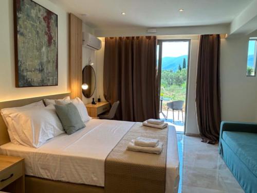 a bedroom with a bed and a large window with a view at Maera Apartments in Sami