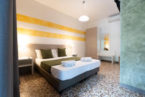 a bedroom with a large bed in a room at B&B K Beach Lake Endine in Endine Gaiano