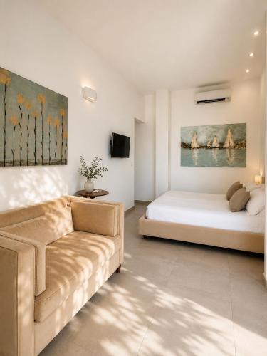 a living room with a couch and a bed at Petra Maris B&B in Peschici