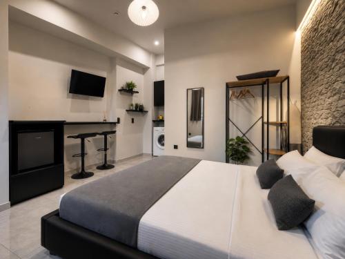 a bedroom with a bed and a desk in a room at ILoveHome Mini in Kalamata