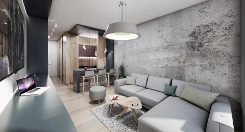 a living room with a couch and a table at Olaf Bjelašnica in Gornja Presjenica