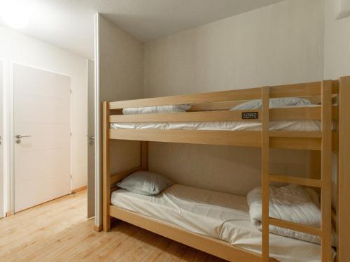 a bunk bed room with two bunk beds at Les Chalets d Ax N212 - 2P6C in Ax-les-Thermes