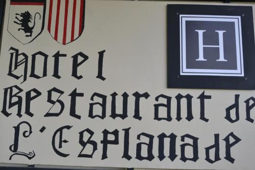 a sign for the detroit tigers hanging on a wall at Hotellerie de l'Esplanade in Rians