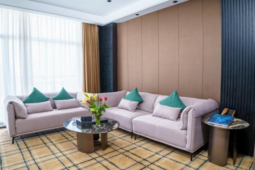 a living room with two couches and a table at OCEAN HOTEL in Phnom Penh
