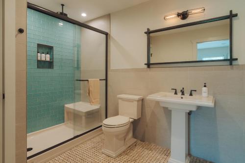 a bathroom with a toilet and a sink and a shower at Hot Tub Fire Pit Mountain Retreat Deer Meadows in Jeffersonville
