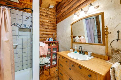 a bathroom with a sink and a mirror at Unplug! Lake Toxaway Cabin w/ Dock Access in Lake Toxaway
