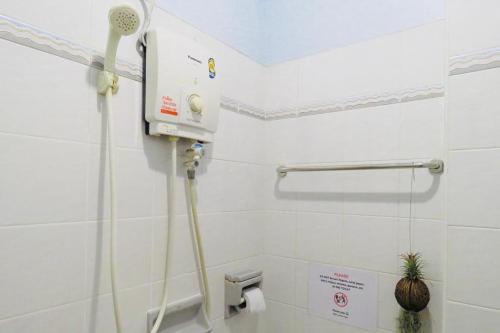 a shower in a bathroom with a toilet at Mam's House Khaosan in Bangkok