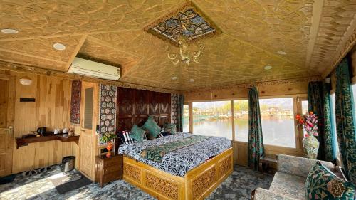 a bedroom in a train with a bed and a window at Smith Palace Group Of Houseboats in Srinagar