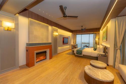 a bedroom with a bed and a fireplace at Weekend Retreat- Hotel & Spa in Kurseong