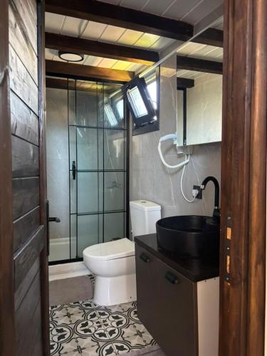 a bathroom with a toilet and a sink and a shower at Villa Myra in Beymelek