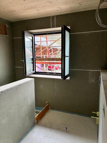 an empty room with a window in a building at Ferienhof Haug in Bad Hindelang