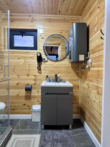 a bathroom with a sink and a mirror at Tengri House A-Frame Issyk-Kul in Kaji-Say