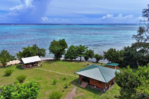 an aerial view of a resort near the ocean at Fare Heimery - Private Lagoon Beach in Haapiti