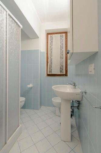a bathroom with a sink and a toilet and a shower at Casa Bice Casa Vacanze in Case Pieve al Toppo