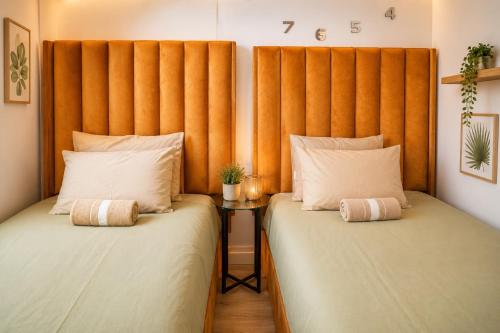 two beds sitting next to each other in a room at MariSal at 77 Independence avenue CBD in Windhoek