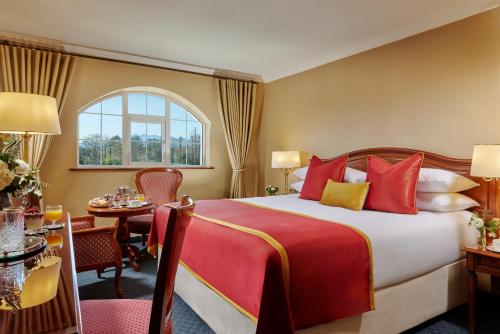 a hotel room with a bed and a table at Killarney Avenue in Killarney