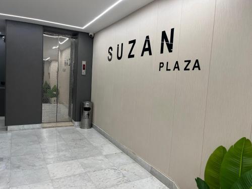 a building with a sign on the wall at Suzan Hotel Apartments in Amman