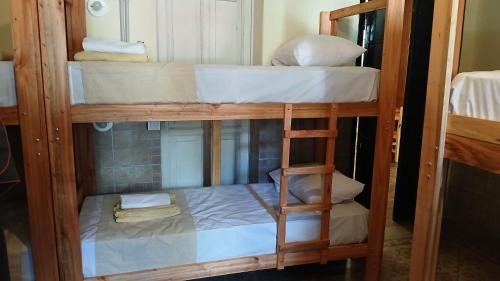 a group of bunk beds in a room at MillaUno Hostel in Córdoba