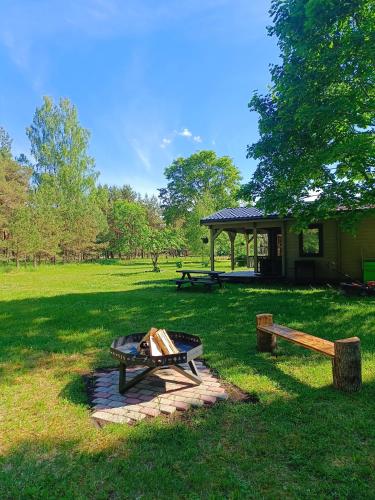 a picnic table and a pavilion in a park at Mežmaļi in Jūrkalne