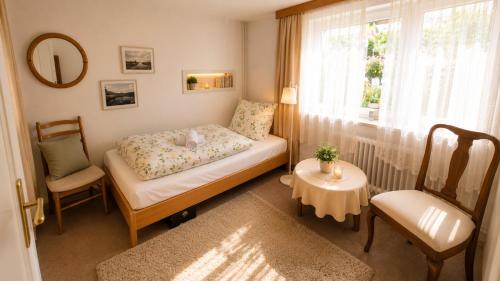 a small bedroom with a bed and a window at unterkunft Cuxhaven in Cuxhaven