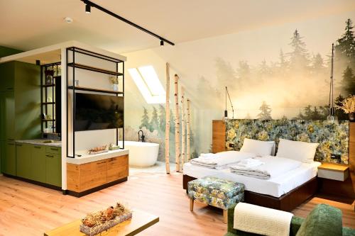 a bedroom with a large bed and a bath tub at Wald & Wiese Hornstein in Hornstein