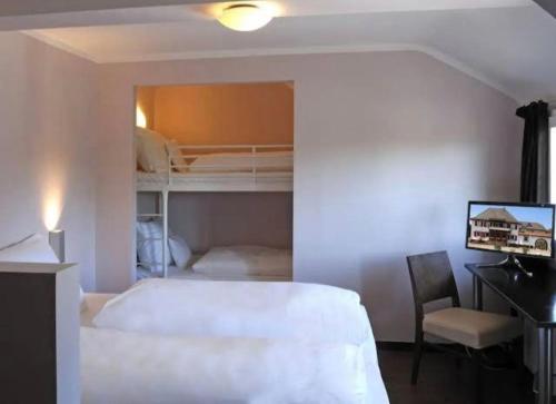 Lova arba lovos apgyvendinimo įstaigoje Hotel Maxsoyi