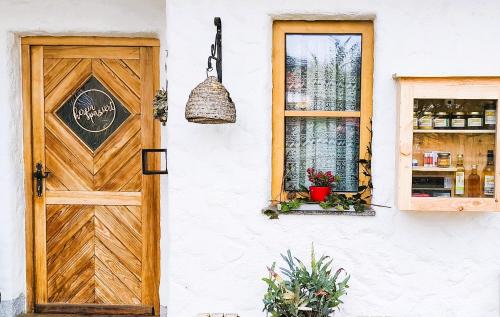 a door and window on a white building at Honigduft und Bienenluft in Sankt Oswald bei Freistadt