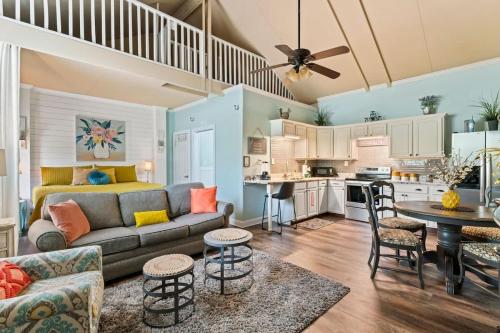 a living room with a couch and a table at The Poolside Studio - Lounge Pool Wifi in Jacksonville