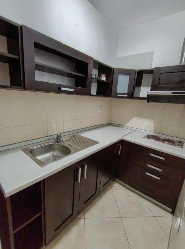 a kitchen with a sink and a counter top at Riviera Budva Residence in Budva