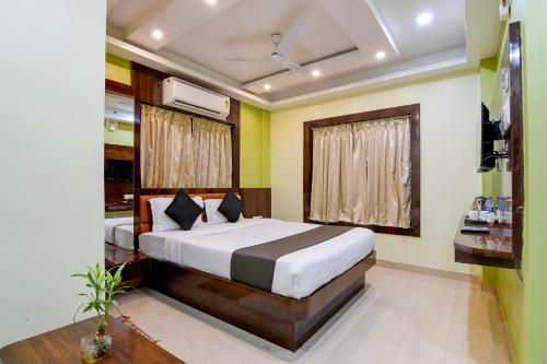 a bedroom with a bed and a window at The Fortune Hotel, Newtown in New Town