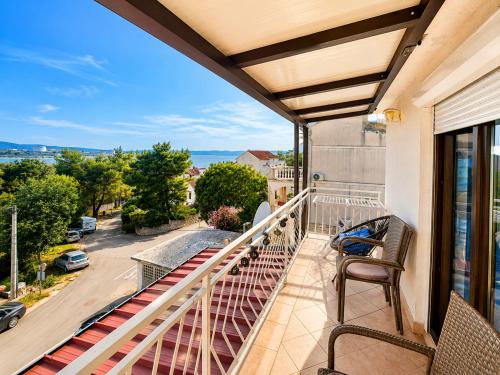 a balcony with a view of a street at Apartment RB in Omišalj