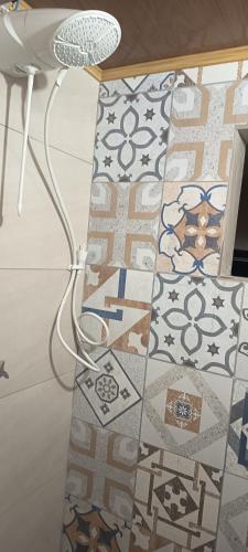 a room with a floor with tiles on it at Espaço Jk in Diamantina