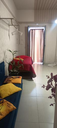 a room with two beds and a window at Espaço Jk in Diamantina