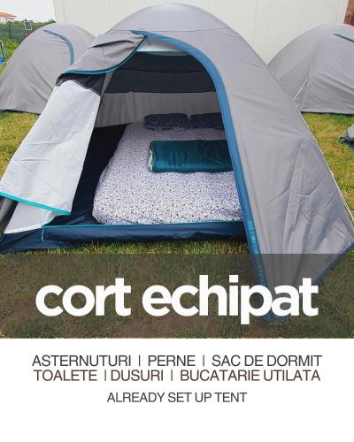 a tent with a bed inside of it at Free People Bungalow & Cort in Vama Veche